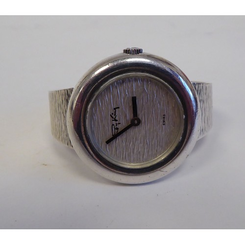 97 - A lady's, circa 1975, Roy King 925 silver and bark effect, round cased bracelet wristwatch with a me... 