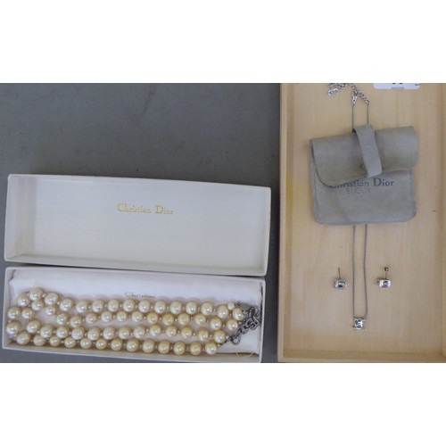 93 - Christian Dior, viz. a double strand, simulated pearl necklace, on an S-design clasp, in an original... 