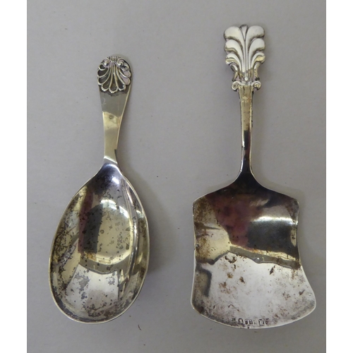 139 - A 19thC silver caddy spoon  marks rubbed; and an Edward VII example  Sheffield 1909