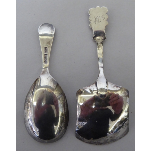 139 - A 19thC silver caddy spoon  marks rubbed; and an Edward VII example  Sheffield 1909