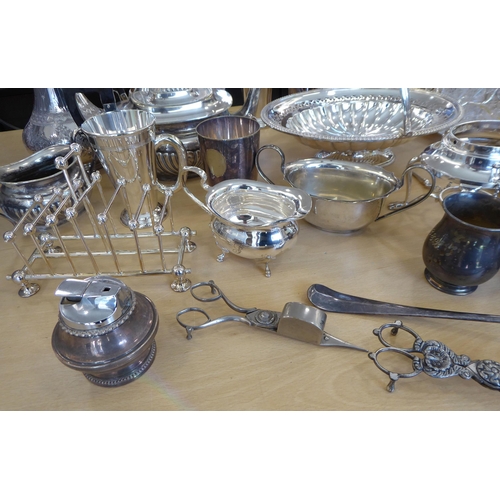 257 - Silver plated tableware: to include a cruet with four glass bottles