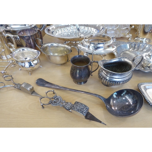257 - Silver plated tableware: to include a cruet with four glass bottles