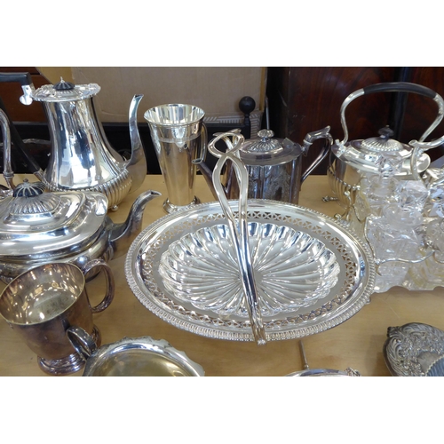 257 - Silver plated tableware: to include a cruet with four glass bottles