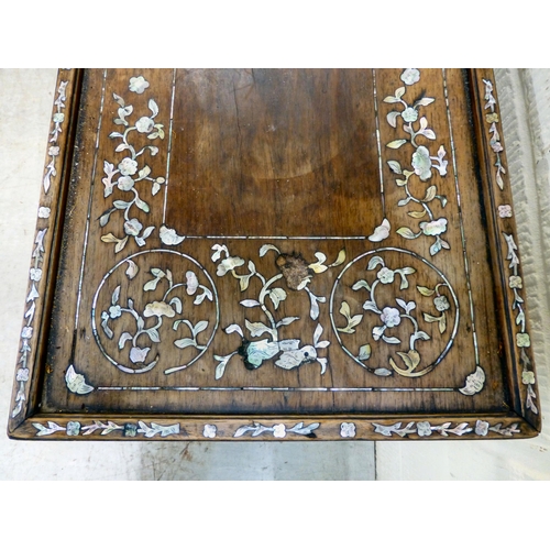 295 - An early/mid 20thC mother-of-pearl inlaid fruitwood, two tier occasional table, raised on splayed le... 