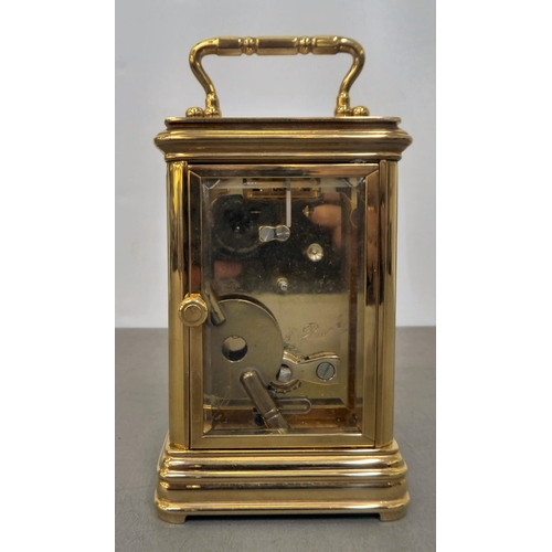 55 - A modern Thwaits and Reed brass and glazed cased carriage timepiece, faced by a Roman dial  5