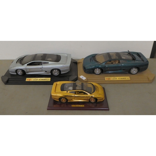 93 - Two Maisto Jaguar scale model XJ220 sports cars, circa 1992; and another smaller