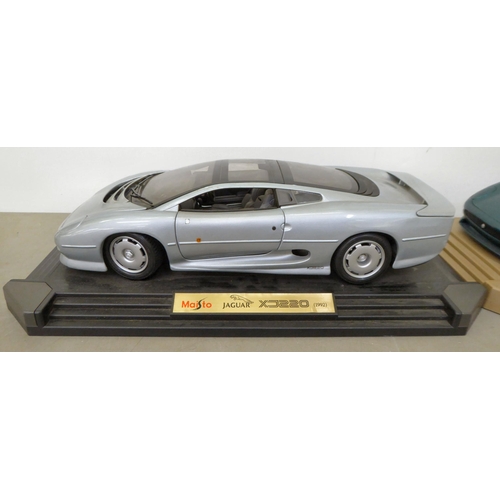 93 - Two Maisto Jaguar scale model XJ220 sports cars, circa 1992; and another smaller