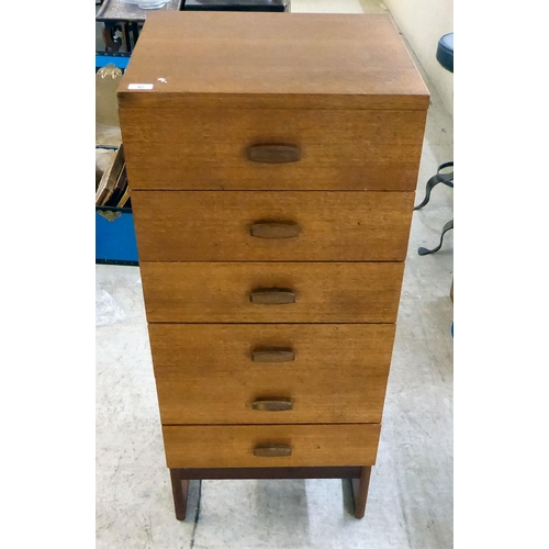 97 - A modern teak tallboy, consisting of six drawers, raised on shaped legs  46