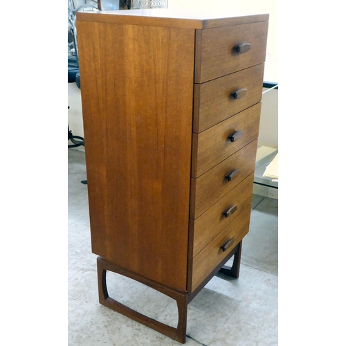 97 - A modern teak tallboy, consisting of six drawers, raised on shaped legs  46