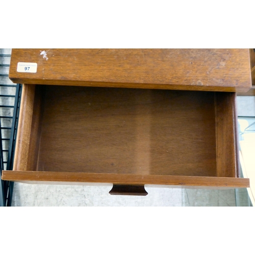 97 - A modern teak tallboy, consisting of six drawers, raised on shaped legs  46