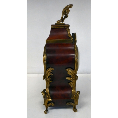 100 - A late 19thC French gilt metal mounted and laminated, three piece clock garniture with ornately cast... 