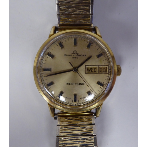 102 - A Baume & Mercier Tronosonic stainless steel cased bracelet wristwatch, faced by a gilded baton ... 