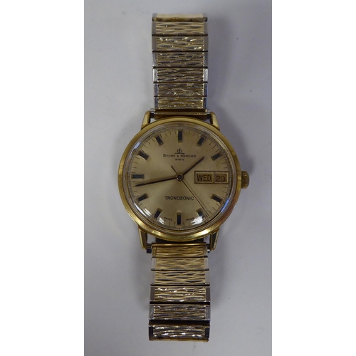 102 - A Baume & Mercier Tronosonic stainless steel cased bracelet wristwatch, faced by a gilded baton ... 