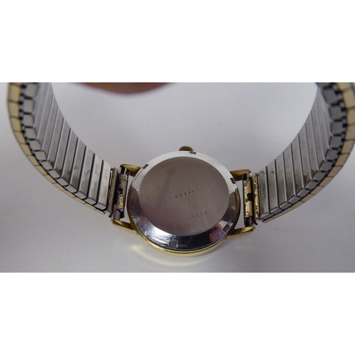 102 - A Baume & Mercier Tronosonic stainless steel cased bracelet wristwatch, faced by a gilded baton ... 