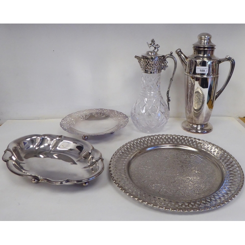 109 - Silver plated tableware: to include a cocktail jug of panelled, tapered form; and a cut crystal wine... 