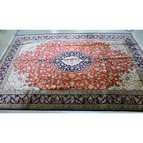 120 - A Qum design silk rug, decorated with a central medallion, surrounded and bordered by floral and bir... 