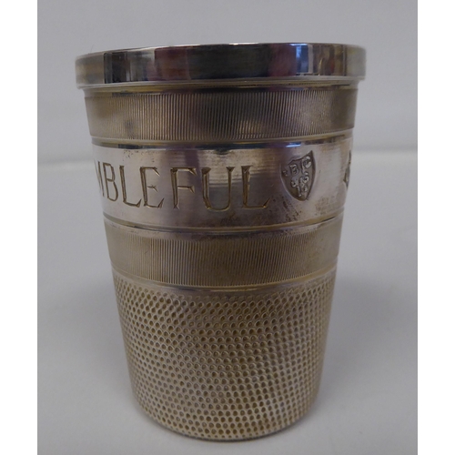 68 - A silver 'Just a Thimble Full' tot cup&nbsp; BC & S&nbsp; Birmingham 1979&nbsp; cased