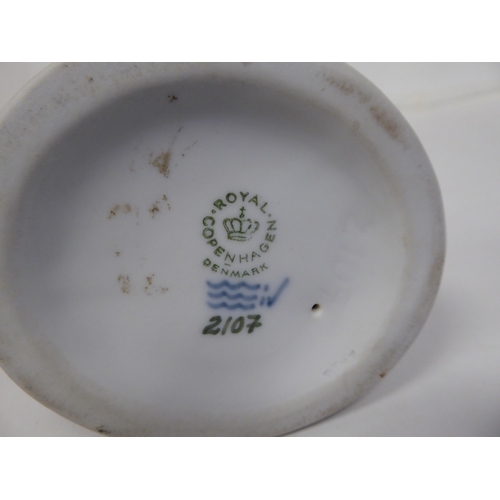 70 - A Royal Copenhagen porcelain figure, No.2107, a faun with an owl  6.25