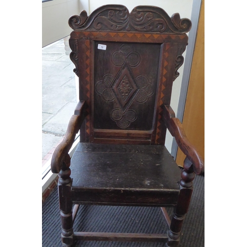 75 - An 17th/18thC oak wainscot chair, the panelled back with an inlaid border, set in an ornate diamond ... 