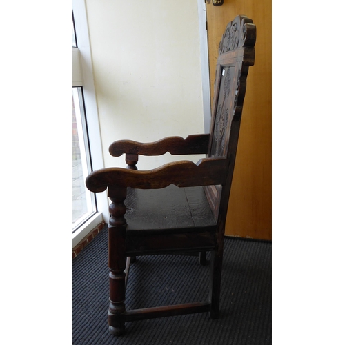 75 - An 17th/18thC oak wainscot chair, the panelled back with an inlaid border, set in an ornate diamond ... 