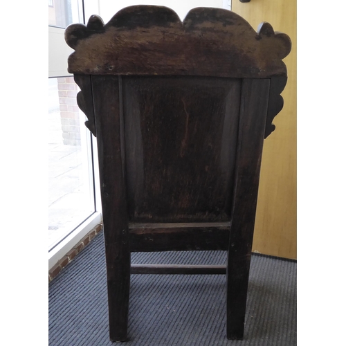 75 - An 17th/18thC oak wainscot chair, the panelled back with an inlaid border, set in an ornate diamond ... 