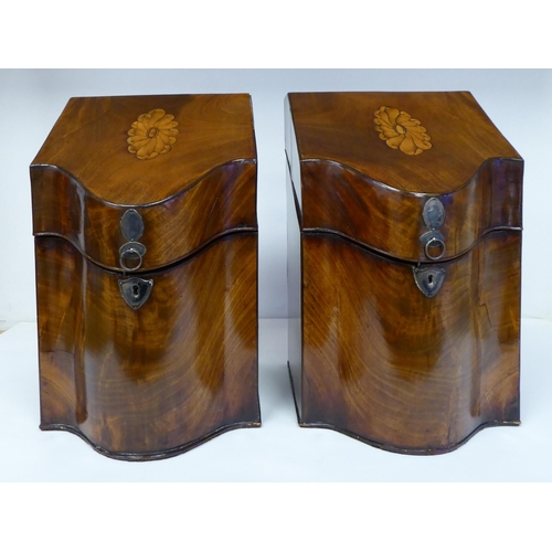 79 - A pair of Regency serpentine front, mahogany knife boxes with satin marquetry ornament on the angled... 