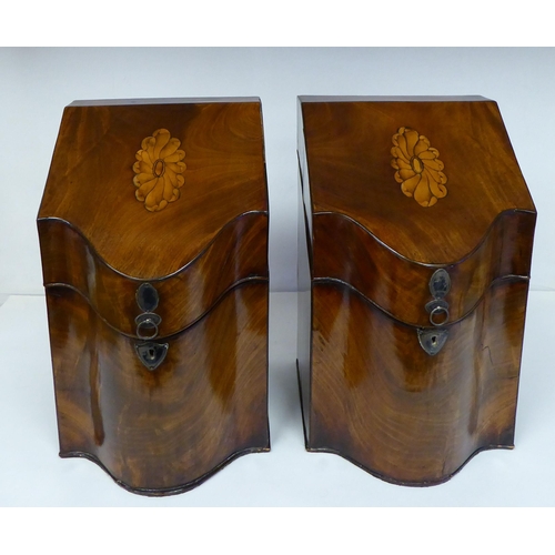 79 - A pair of Regency serpentine front, mahogany knife boxes with satin marquetry ornament on the angled... 