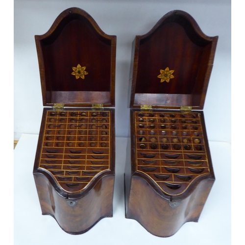 79 - A pair of Regency serpentine front, mahogany knife boxes with satin marquetry ornament on the angled... 