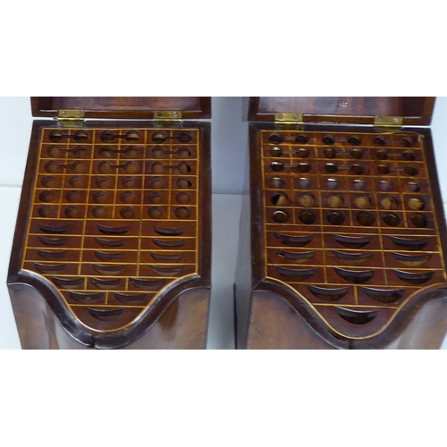 79 - A pair of Regency serpentine front, mahogany knife boxes with satin marquetry ornament on the angled... 