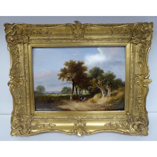 91 - Early 19thC British School - a study of two figures in a wooded lane with cattle beyond  oil on pane... 