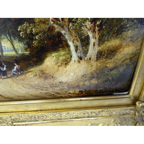 91 - Early 19thC British School - a study of two figures in a wooded lane with cattle beyond  oil on pane... 