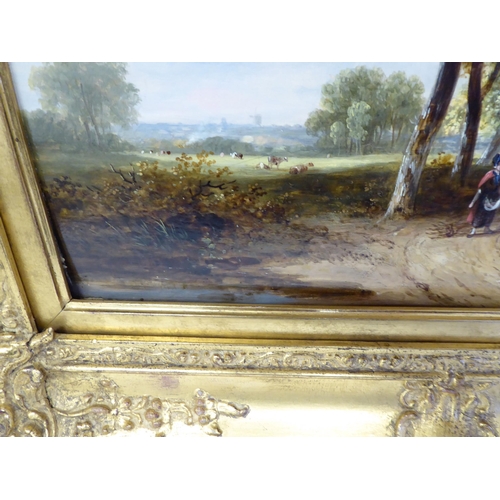 91 - Early 19thC British School - a study of two figures in a wooded lane with cattle beyond  oil on pane... 