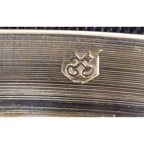 94 - A matched set of twelve silver plated, bead bordered platters  12