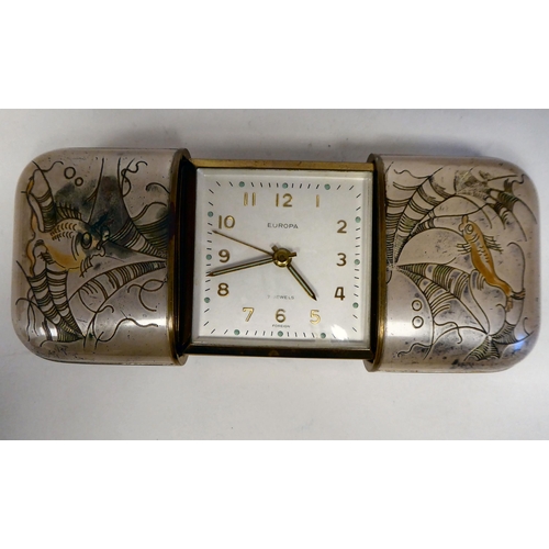98 - A Europa traveller's timepiece, having an integral sliding, two-part lacquered brass and coloured en... 
