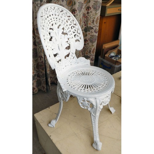 116 - A late Victorian, later white painted, five piece cast iron terrace set  comprising a table, ornamen... 