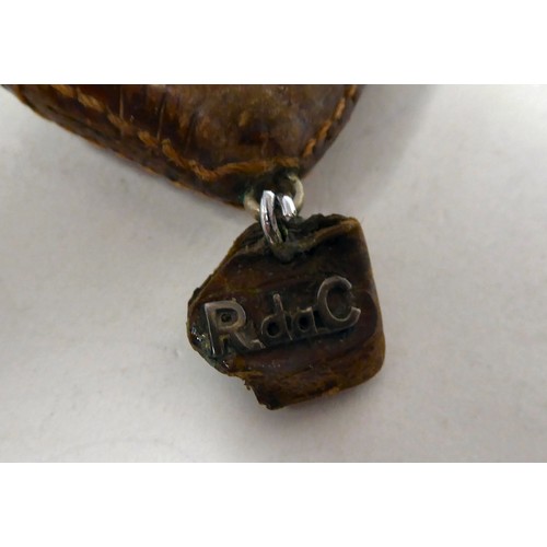 115 - A Movado Ermeto stitched snakeskin clad mechanical watch, faced by a gilded square Arabic dial, stam... 