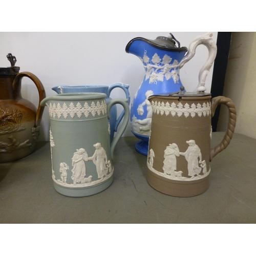 280 - 19thC and later jugs: to include a Victorian salt glazed Harvest jug with a silver plated lid&nbsp; ... 