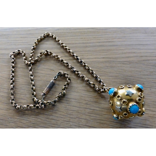 1 - A yellow metal ball design pendant, decorated in relief with turquoise coloured, circular and star p... 