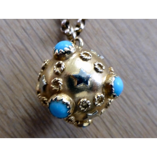 1 - A yellow metal ball design pendant, decorated in relief with turquoise coloured, circular and star p... 