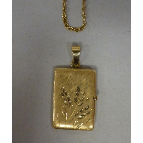 10 - An 18ct gold pendant locket&nbsp; (approx. weight 7 grams), on a 9ct gold chain (approx. 2.9 grams)