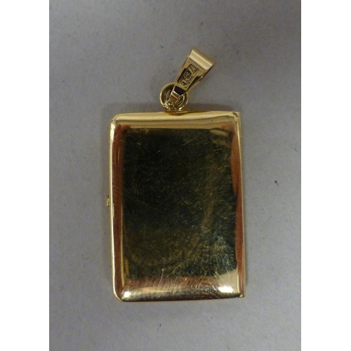 10 - An 18ct gold pendant locket&nbsp; (approx. weight 7 grams), on a 9ct gold chain (approx. 2.9 grams)