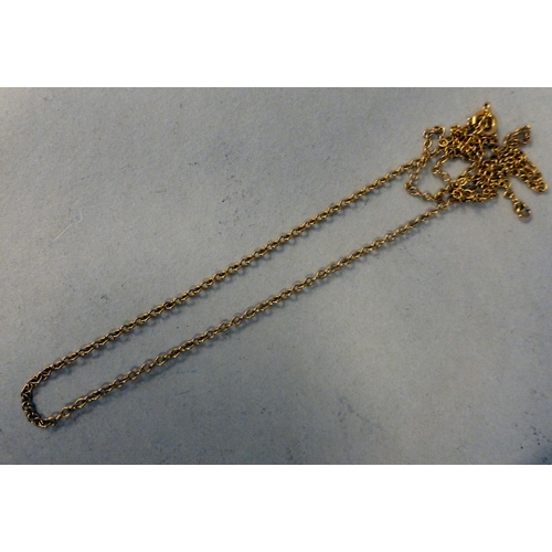 10 - An 18ct gold pendant locket&nbsp; (approx. weight 7 grams), on a 9ct gold chain (approx. 2.9 grams)