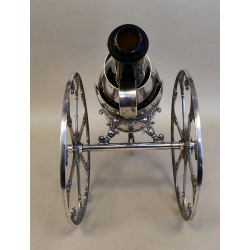 11 - A WMF silver plated wine cannon, on two wheels  7.5