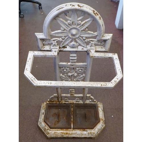 16 - A late Victorian Falkirk painted cast iron stickstand, attributed to Christopher Dresser with decora... 