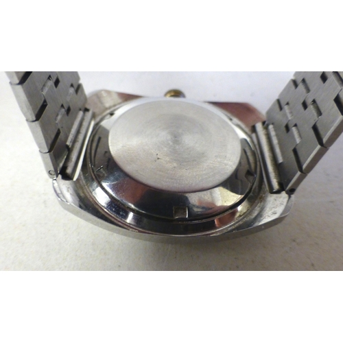 18 - A JW Benson stainless steel cased manual bracelet watch, faced by a baton and Arabic dial