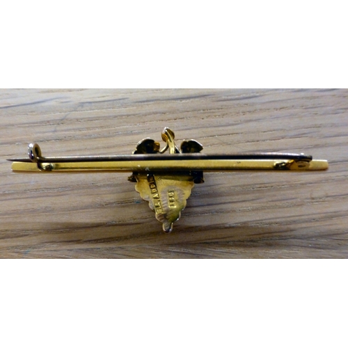 2 - A yellow metal bar brooch, surmounted by a bunch of grapes under foliage&nbsp; stamped 18ct verso&nb... 