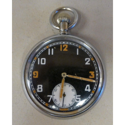 20 - A World War II military white metal cased pocket watch, stamped GSTP 349275, faced by an Arabic dial