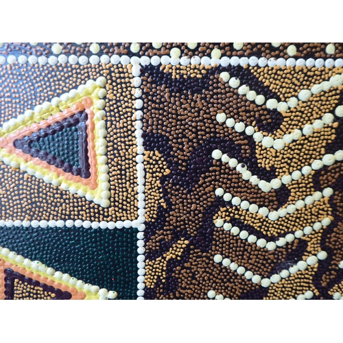 21 - An Aboriginal painting, depicting fish and other ornament, in muted colours and geometric forms  21