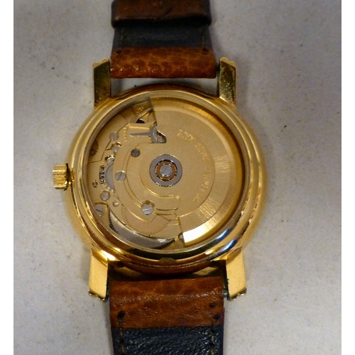 23 - An ETA Swiss Technology, gold plated automatic wristwatch, faced by a baton dial and date aperture