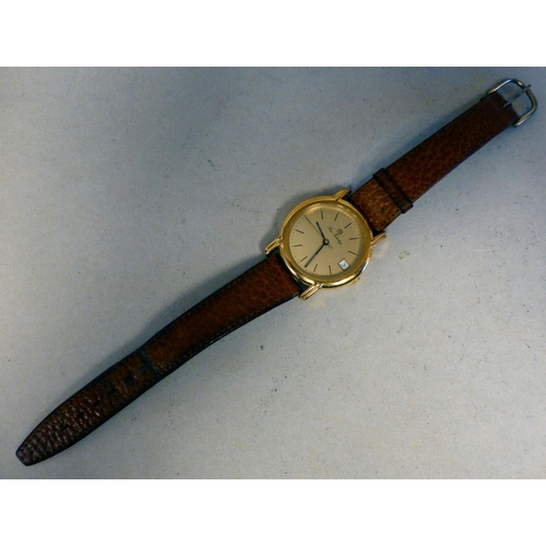 23 - An ETA Swiss Technology, gold plated automatic wristwatch, faced by a baton dial and date aperture